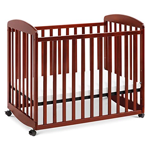 DaVinci Alpha Mini Rocking Crib in Rich Cherry, Removable Wheels, Greenguard Gold Certified